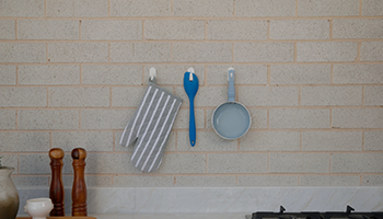Kitchen utensils hanging from wall